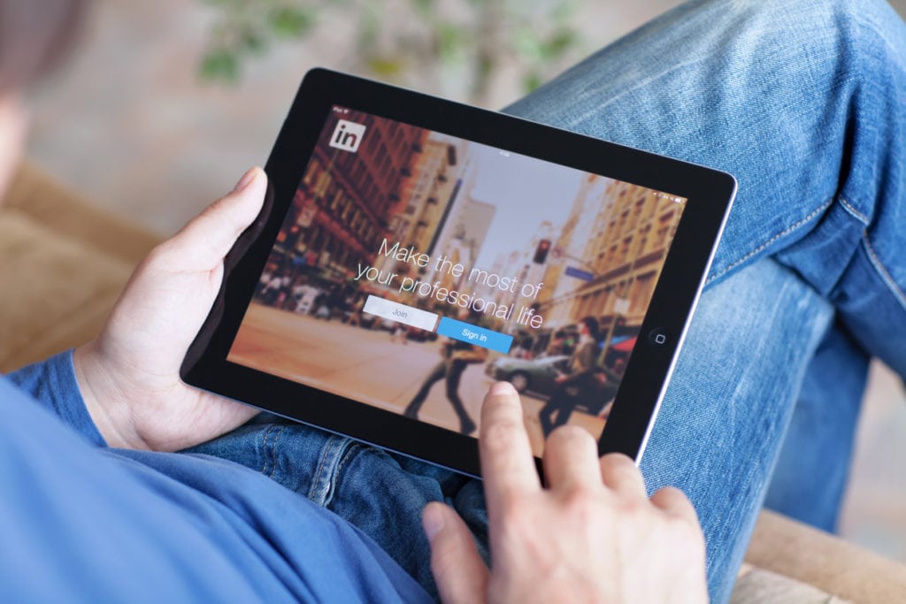 Man-with-LinkedIn-on-iPad-screen
