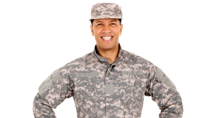 veteran wearing military garb and smiling