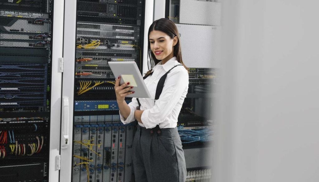 Woman in front of servers for a technical interview